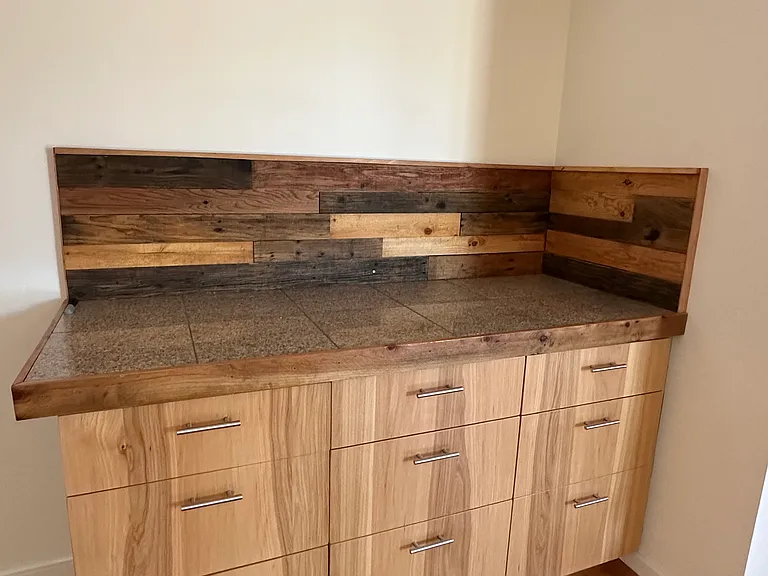 Granite tile countertop with Hickory drawer fronts.