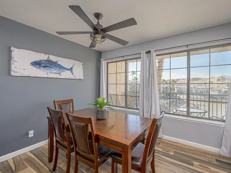 Dining table with large picture windows. Table will sit 6.