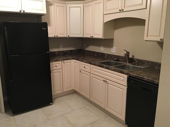 Kitchen with Black Appliances and custom cabinets
