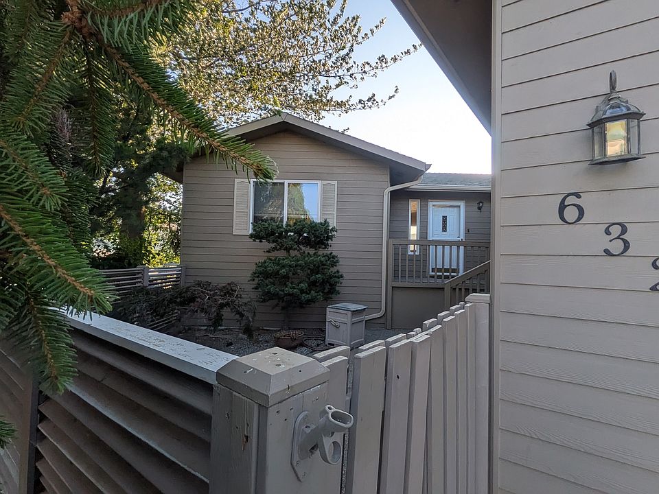 Front of home with private deck and patio.