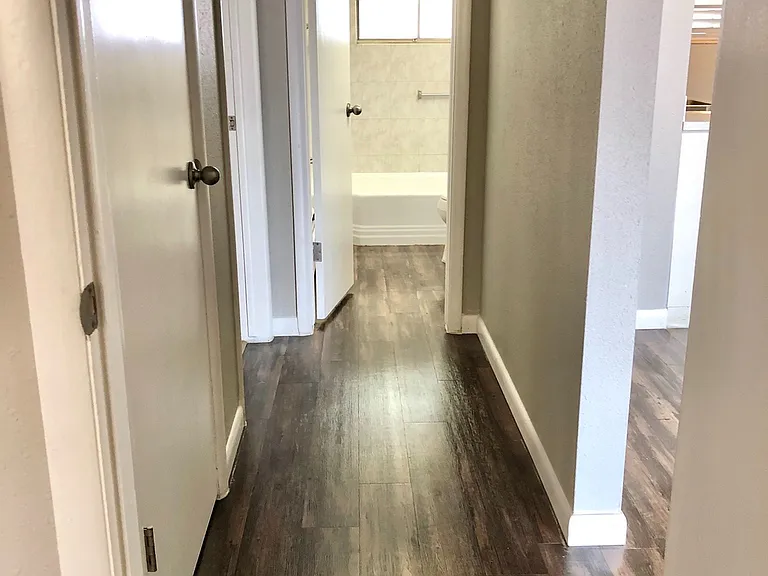 Experience the elegance of this bright and spacious hallway, featuring modern wood flooring. Experience the elegance of this bright and spacious hallway, featuring modern wood flooring.