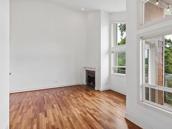 Living room w/ wood-burning fireplace