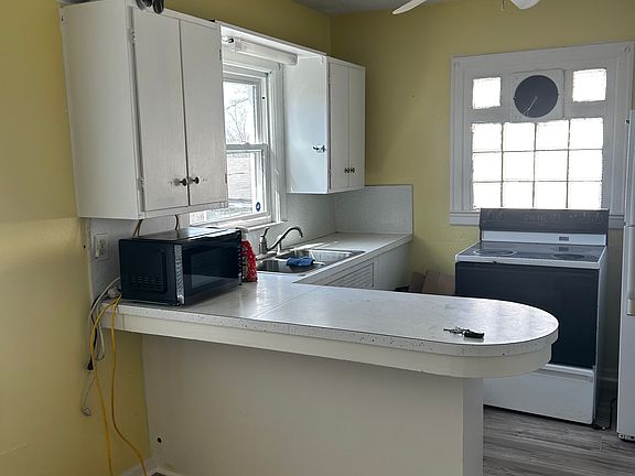 Eat in kitchen with gas stove and brand new refrigerator and microwave. Laundry off the kitchen offers nice front loading washer and dryer.