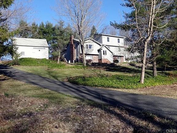 View from the country road. There are two paved driveways, this is the left side one, for the barn