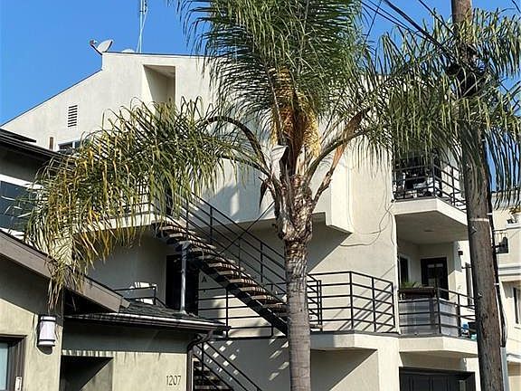 Outdoor staircase up one flight to the front door, over the 2 car garage. The second staircase goes to the deck.