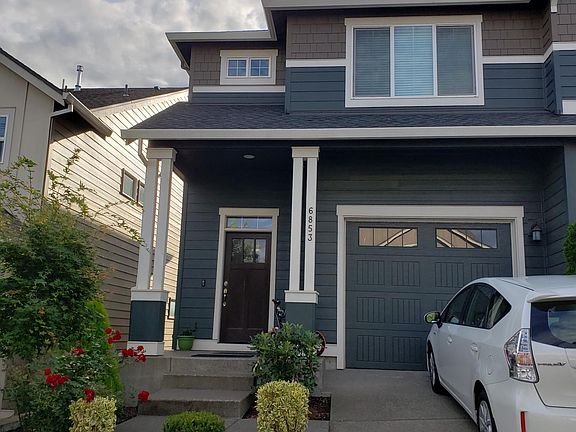 Front house view. Zero maintenance front lawn.