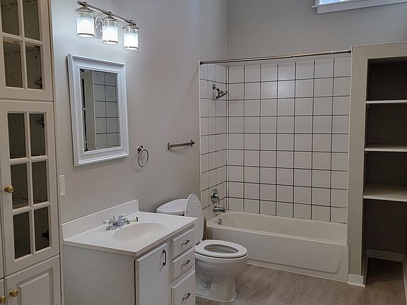 New vinyl floor in large bathroom with high ceiling.