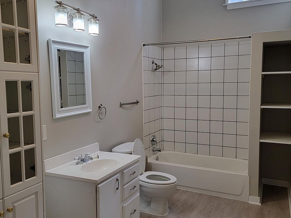 New vinyl floor in large bathroom with high ceiling.