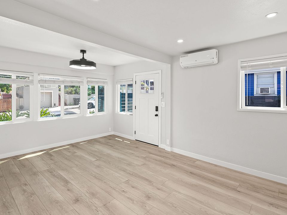 Open Living area with blinds, lighted fan and mini split