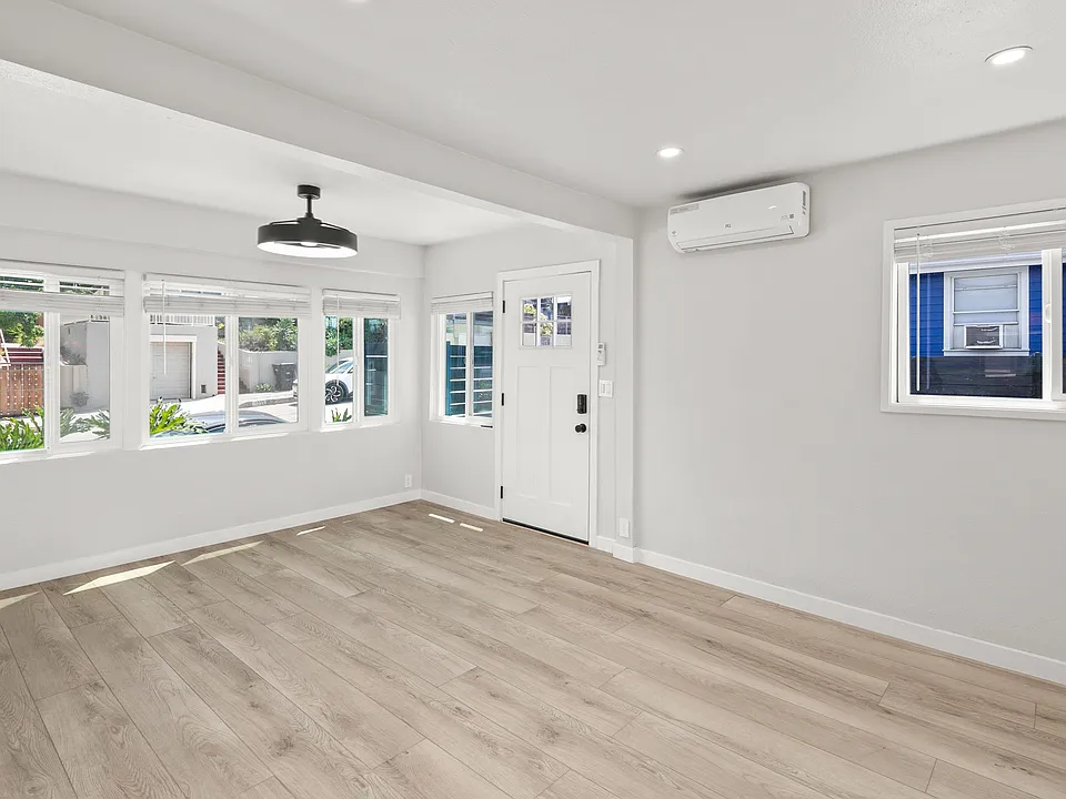Open Living area with blinds, lighted fan and mini split