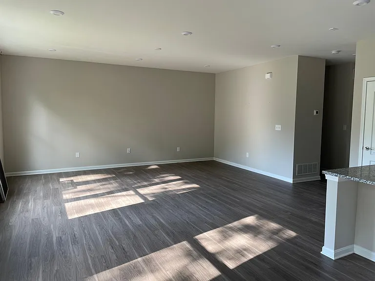 Living room is open to kitchen.