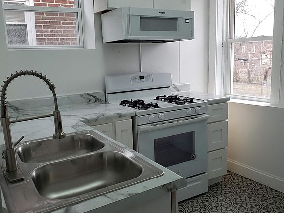 Updated appliances, including a refrigerator.