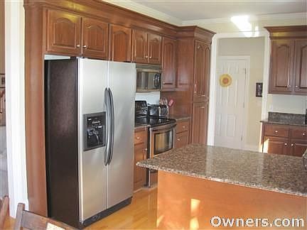 Custom granite countertops in kitchen.