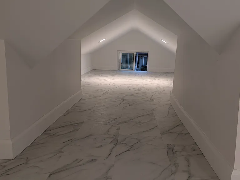 tunnel leading to a smaller flex space area