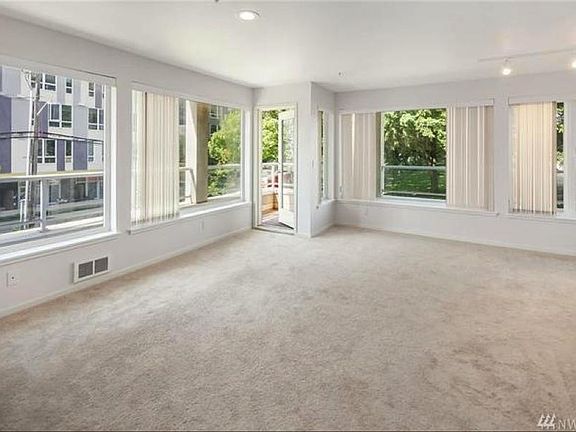 Living room with large windows and balcony
