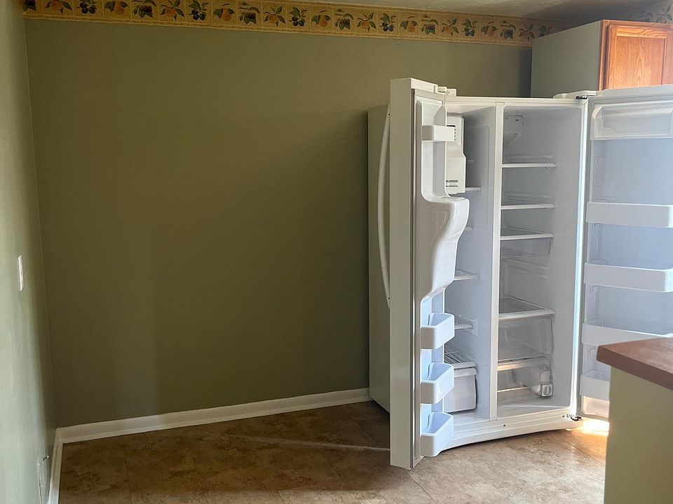 Also kitchen, includes fridge. Space for a kitchen table.