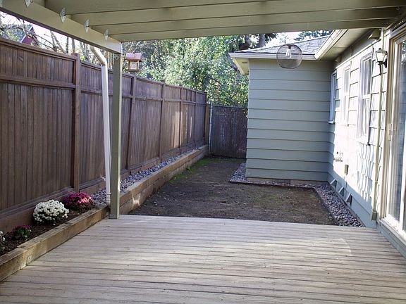 Extra covered patio off the dining room! Grass seed planted and new lawn coming soon!