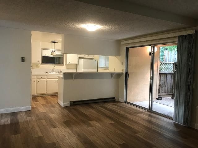 light, bright and airy kitchen with glass stove top range