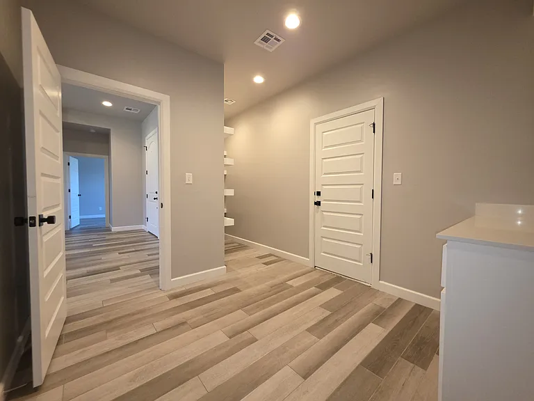 Laundry room with door to garage