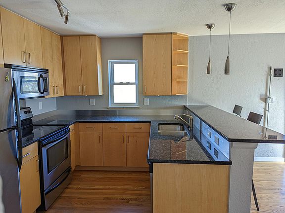 The kitchen (now has new lighting and fresh paint)