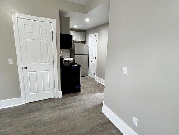 Living room, opening to kitchen