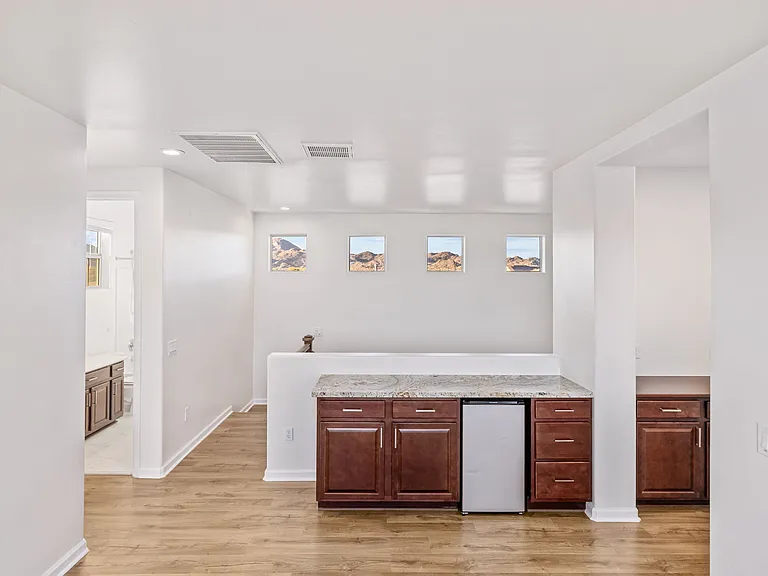Loft area cabinets and mini fridge, Outlet hole in granite for counter top lamp