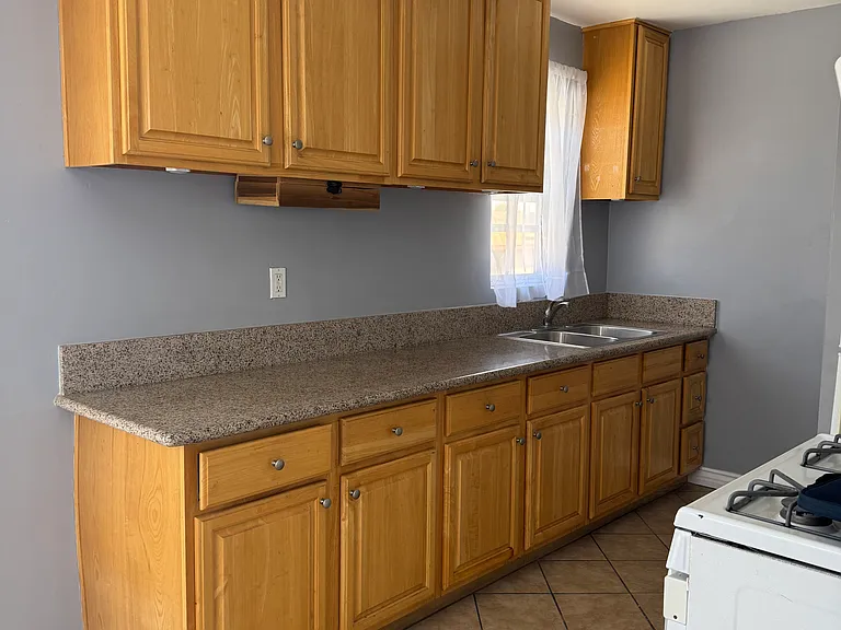 Kitchen with stove and refrigerator