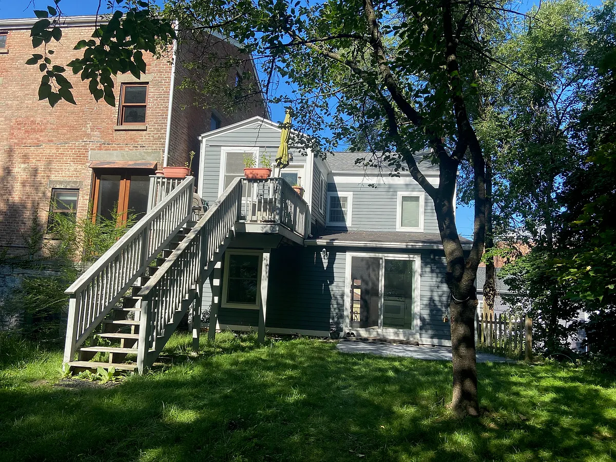 Entrance through kitchen at back w/parking on a back paper road. parking for one car in carport at end of lawn - 9 Hone St #3