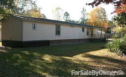 Back of Lot
						:
						This shot was taken on the backside of the property facing the street.