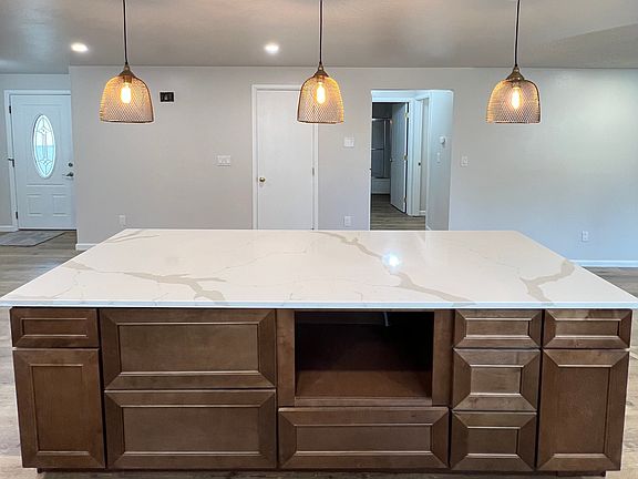 Side view of island that has a slot for a microwave