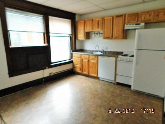 Nice sized eat-in kitchen or if used as a 2 bedroom, living room/kitchen combination. Kitchen features larger refrigerator, apartment sized electric range, and dishwasher.