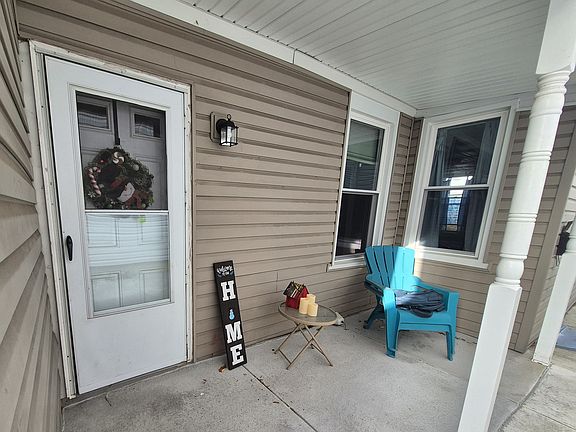 Private patio/porch. Left side door is the entry for this unit not front door.