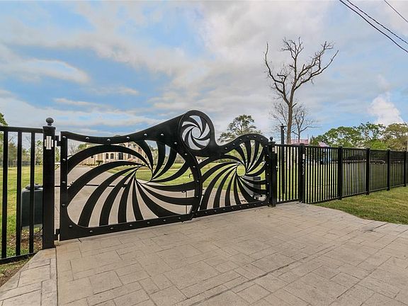 Custom Iron Gates and fence enclose this beautiful estate.