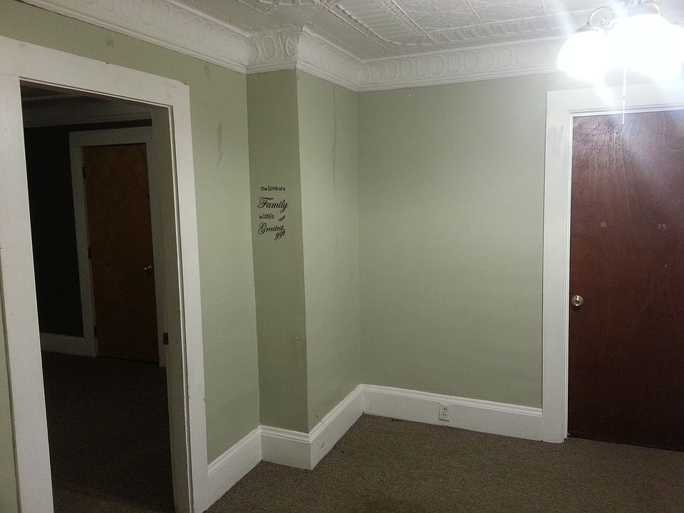 Living room showing doors to the two bedrooms