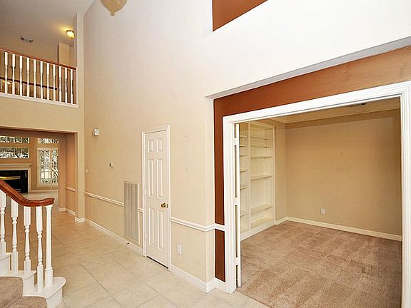 To the right of the foyer is a spacious study or can be formal living/sitting area..