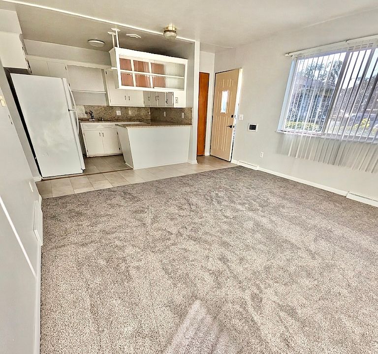 Kitchen and living room - We are awaiting installation of the new kitchen countertops.