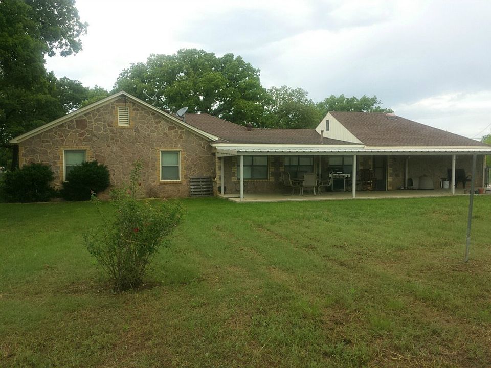 Back of nice backyard with rose bushes and fenced separate yard and small enclosed yard to the side