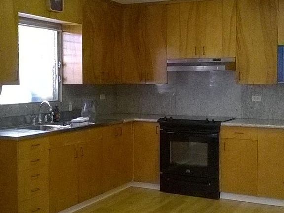 large kitchen with granite counter tops