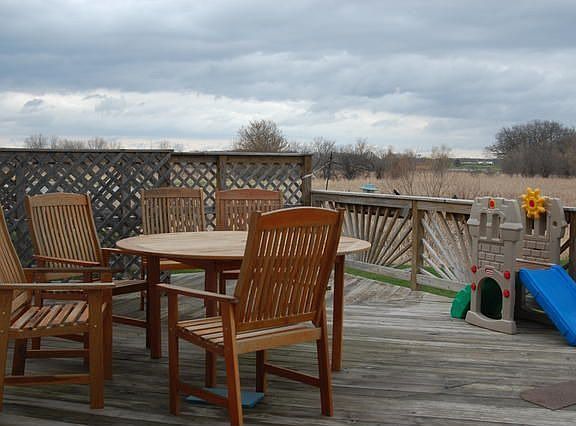 Large deck for entertaining overlooking federally protected wet lands.