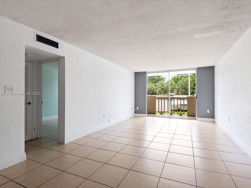 LIVING ROOM VIEW WITH BALCONY