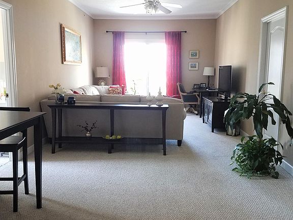 Ample living/ dining room combo with view of Peachtree St. b