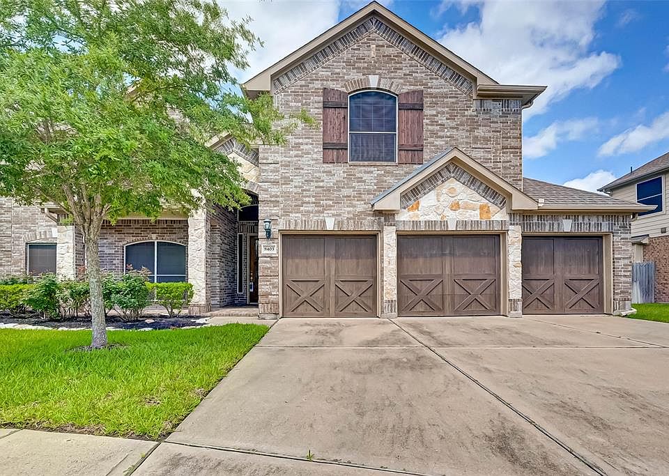 Welcome to this beautiful brick and stone home with covered porch and 3 car garage.