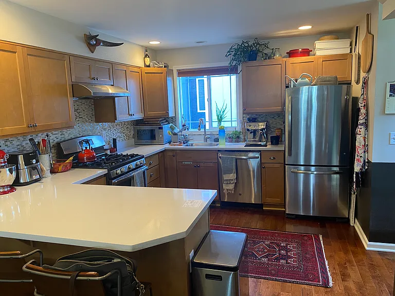 Good sized kitchen with top line fridge/freezer. dishwater and gas stove. Tons of counterspace with beautiful hardwood floors throughout!