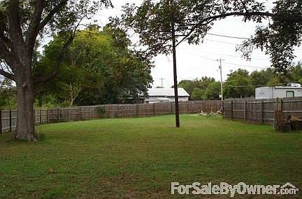Huge back yard with mature pecan trees.