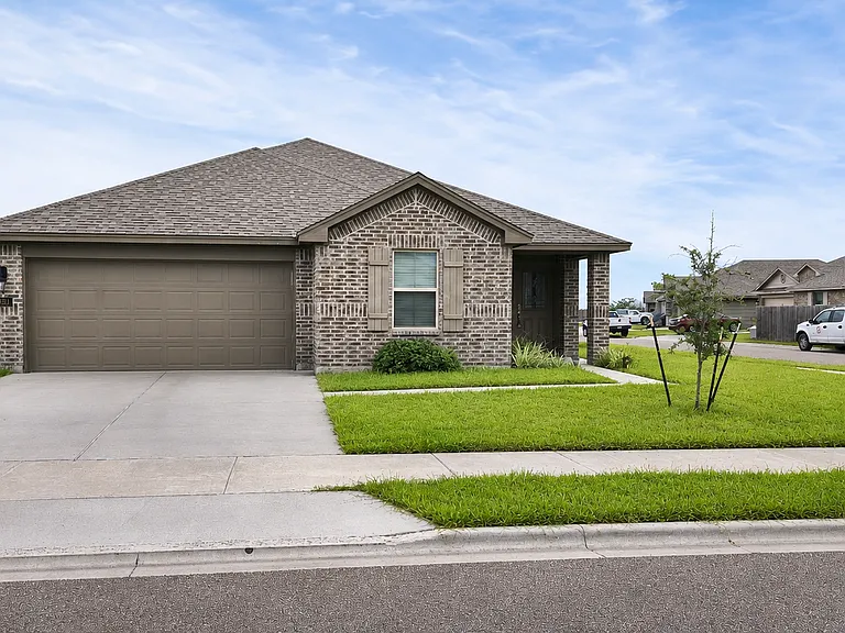 Front exterior _ corner-lot home with attached two-car garage