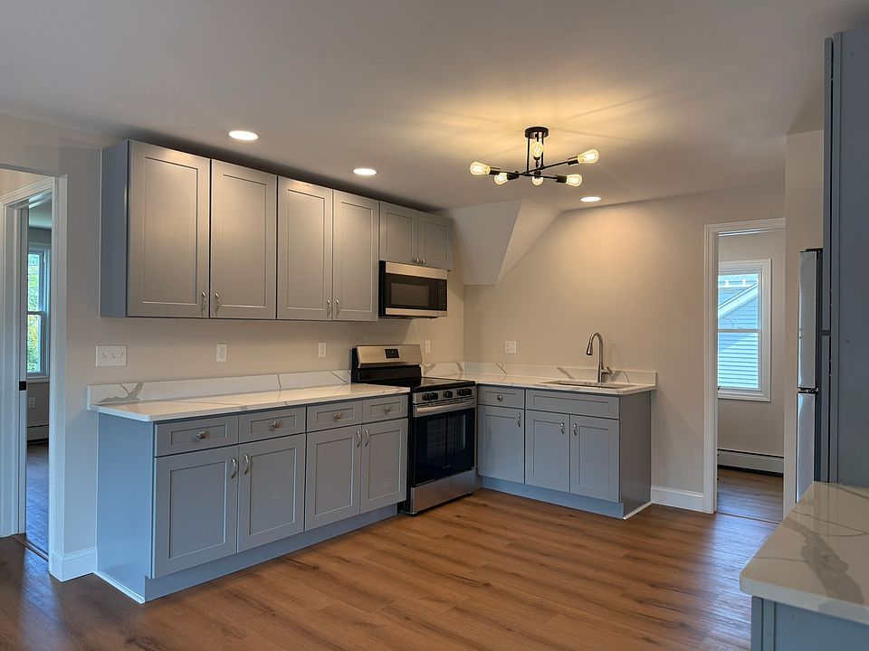 KITCHEN - all brand new appliances, fixtures and finishes, windows. Huge kitchen with lots of cabinet/storage space, quartz countertops and wonderful lighting.