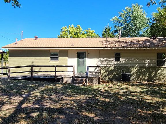 Back door with ramp and concrete porch