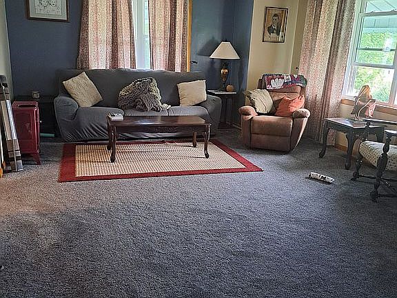 Carpet 7 years. Hardwood under