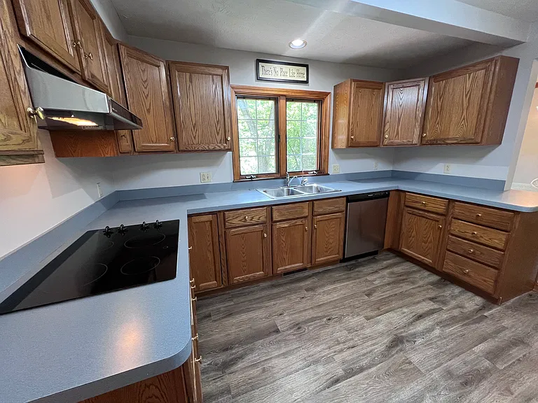 Nice sized kitchen has plenty of storage and pantry closet (not in this photo).