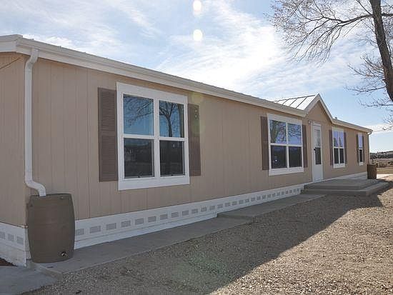 Front view - sidewalks all around house and large front porc